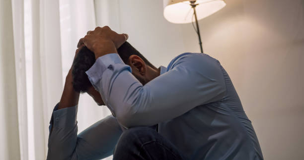 istock A businessman sitting on the floor depressed and stressed with problems in his life. 1606756955