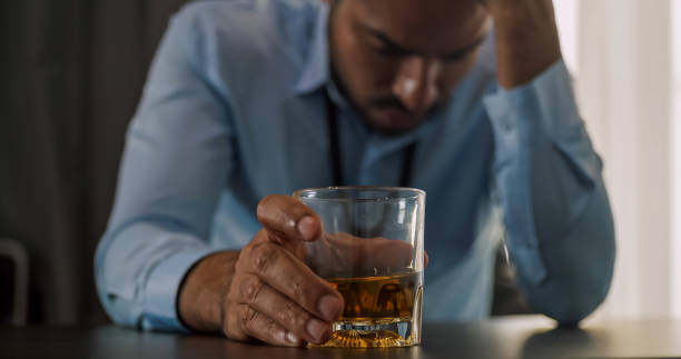 istock A businessman drinking alcohol to relieve depressed and stressed with problems in his life. 1606756956