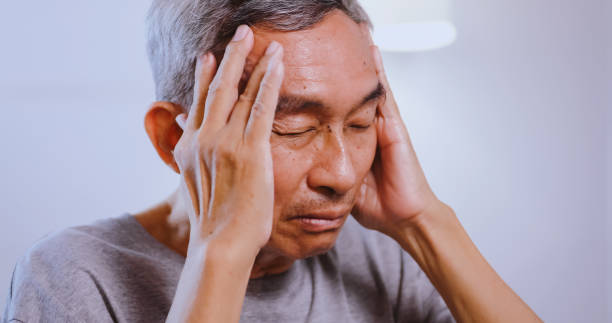istock Asian old man with migraine headache. Elderly man suffering from a headache. 1606757297