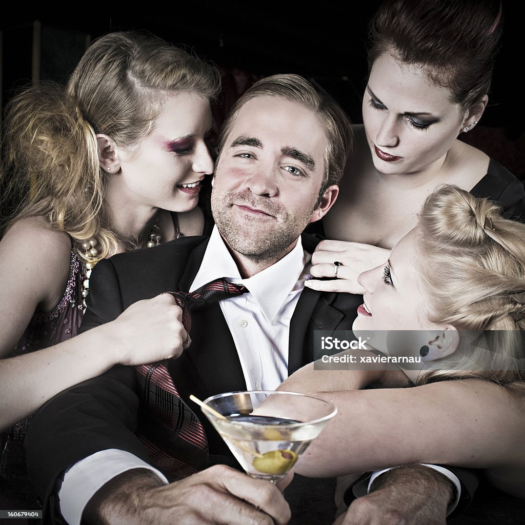 Attraction Three women feeling attraction to a man 25-29 Years Stock Photo