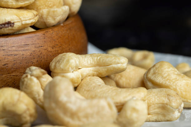 istock Fresh peeled cashew nuts on the table 1606823719