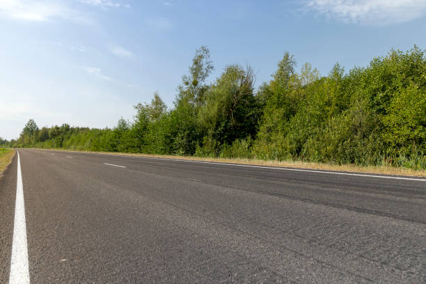 istock Narrow paved road for cars 1606824263