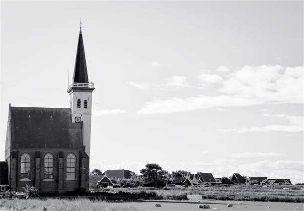 istock Old slightly crooked church on Texel 1606832004