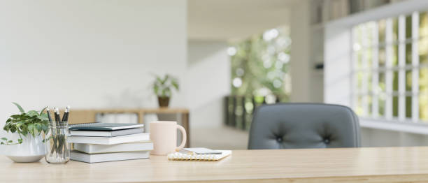 istock A wooden working desk with copy space. blurred modern room background. 1606842060