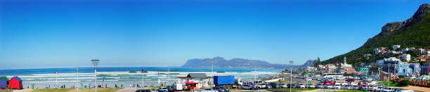 istock Muizenberg Beach, Cape Town, South Afirca, seen in a panorama on a glorious sunny day with vacationers, surfers and swimmers 1606857954