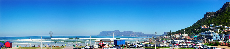 Panoramic view of the famous surfing and swimming beach at Surfer's Corner, Muizenberg, Cape Town, South Africa.