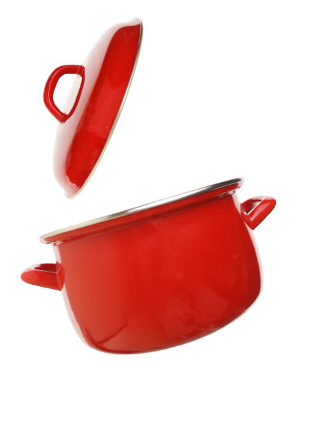 Red new kitchen pot with lid, isolated. Studio shot, copy space.