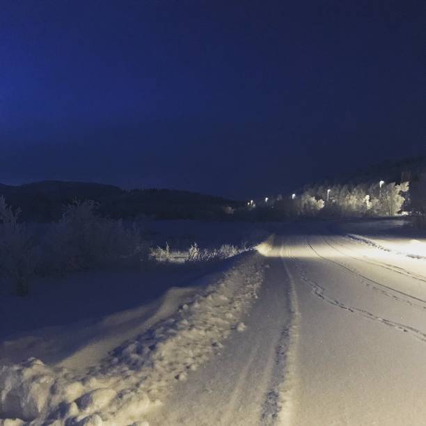 istock Polarnight blue Darkness and snowy street 1606903899