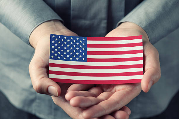 istock American flag in palms 160694837