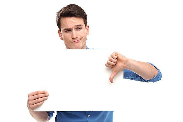 Man showing thumbs down with blank board