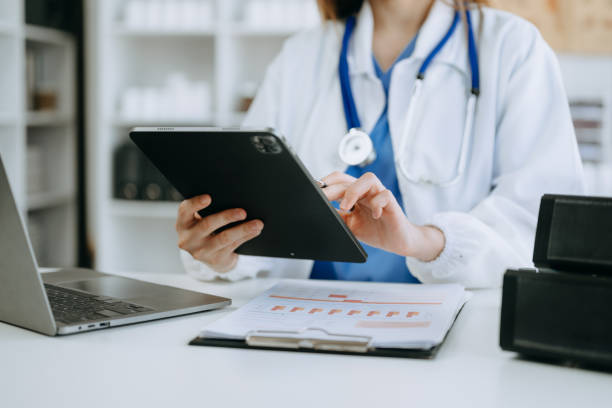 istock Medicine doctor hand working with modern digital tablet computer interface as medical network concept in office 1606981649