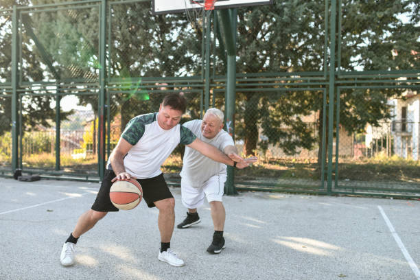 istock Competitive Basketball Match By Two Senior Males 1607003790