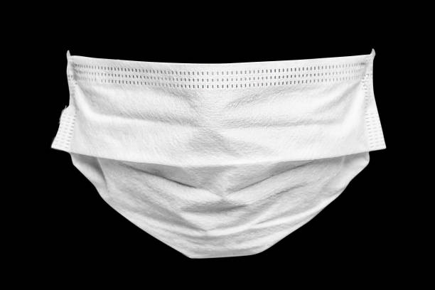 istock a protective mask from coronavirus covid-19 on a black background 1607019389