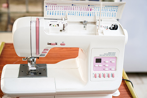 The picture shows a computerized sewing machine for working on clothing repairs at home.