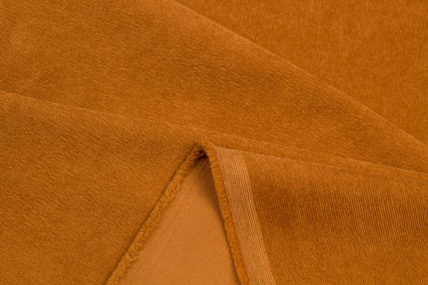istock ribbed corduroy background. corduroy fabric texture. Textile close up flat 1607030180