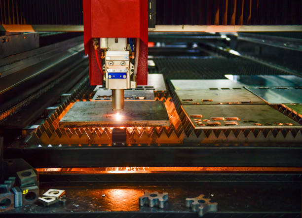 istock Industrial laser cut machine while cutting the sheet metal with the sparking light. 1607038769