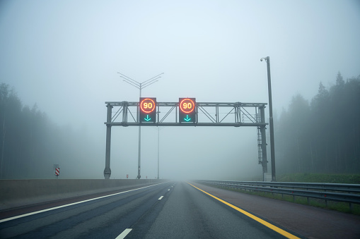 Multi-lane highway in dense fog