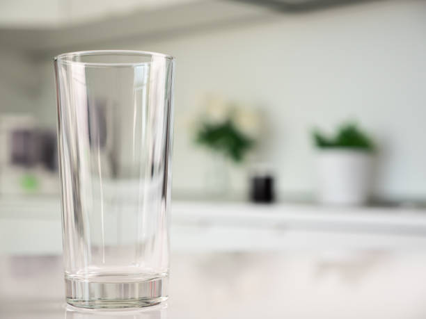istock Clean water in glass on table at the kitchen 1607075227