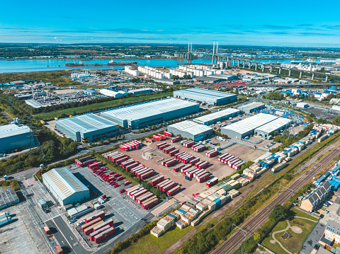 Warehouse fulfilment centre Dartford just opened Kent UK Aerial drone shot over Thames River Kent