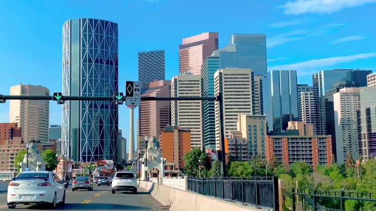 A dolly to the Calgary Downtown by centre street during summer time.