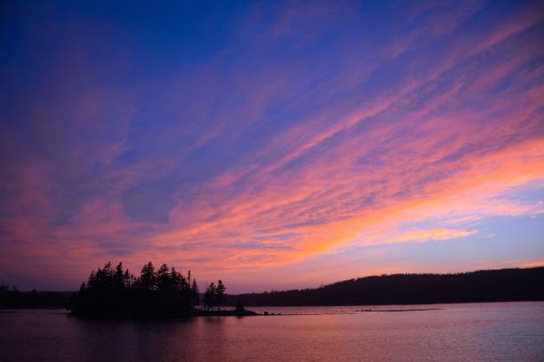 istock Beautiful view of a tranquil lake at sunset 1607108736