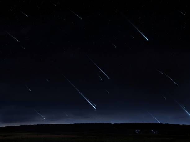 istock Star rain at night. Landscape with falling meteorites. 1607122717