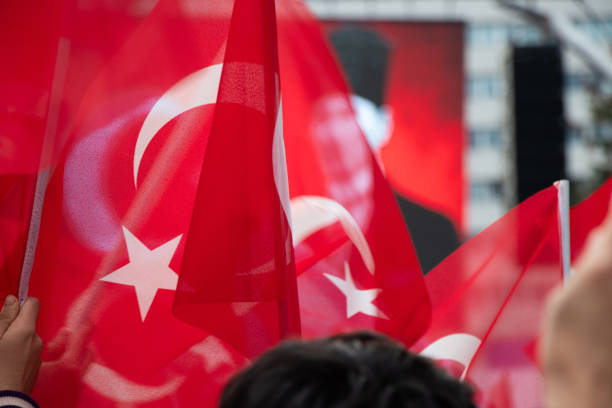 istock Turkish national flags with Ataturk's poster 1607131213