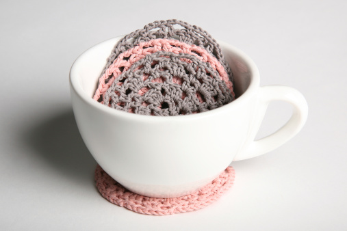 Crochet coasters in a cup