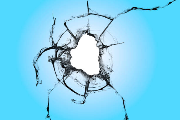 istock A hole in the window with the word blue. The effect of a broken window with cracks. 1607158094