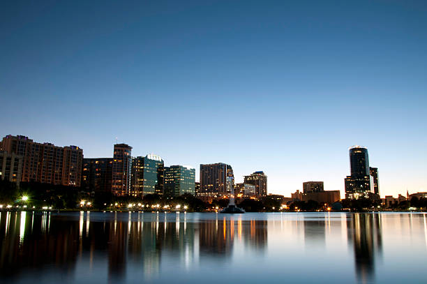 istock Orlando City Skyline at Night Reflecting on Lake Eola 160716601