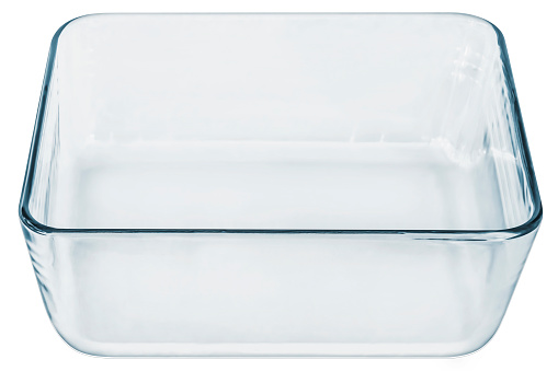 Large rounded rectangle empty clear glass baking dish, isolated on white background, side view.