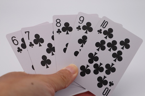 Photo of person with playing cards