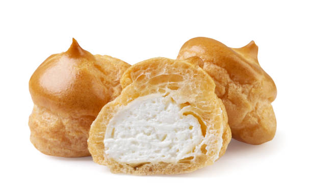 istock Profiteroles and half close-up on a white. Isolated 1607190871