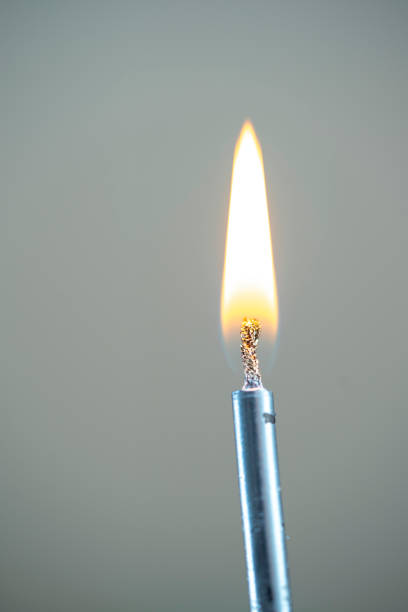 istock blue color wax candle with burnt stir and burning flame under grey background 1607196735