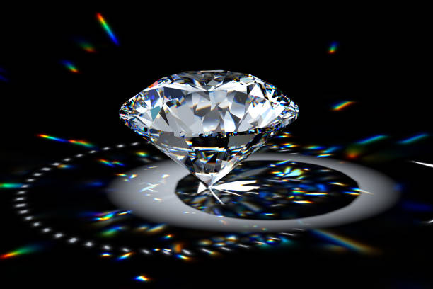 istock Round brilliant diamond in spotlight with colorful refraction rays. 1607218913