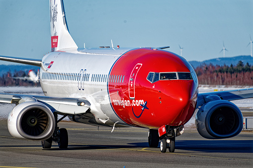 Norwegian Air Shuttle AOC Boeing 737-800 taxing at Oslo Airport, Gardermoen, Norway