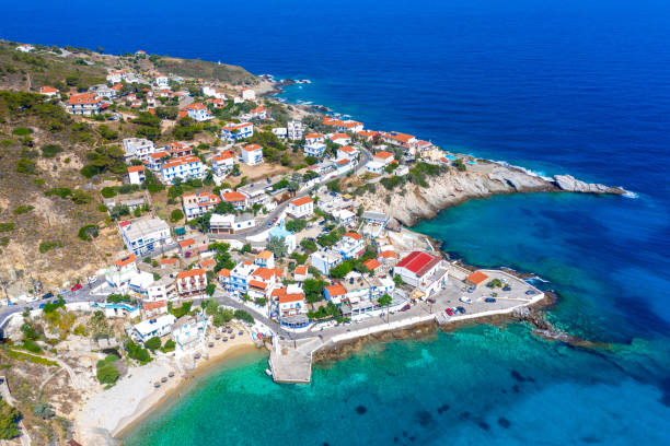 Picturesque small village of Armenistis with amazing sandy beach Mesakti in Ikaria island, Greece. Picturesque small village of Armenistis with amazing sandy beach Mesakti in Ikaria island, Greece. ikaria island stock pictures, royalty-free photos & images