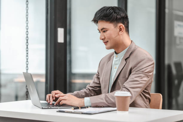 istock Using laptop computer, Asian business asian man supervisor analyse financial report of responsible worker pay attention on mistakes propose correction. 1607244068