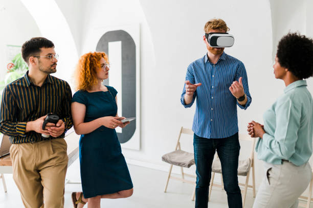 istock Business team presenting new project to a client on a virtual reality simulator. 1607258796