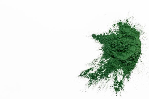 istock Splash of spirulina algae powder on white background, top view 1607261006
