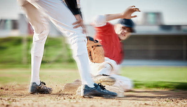 istock Baseball, sports and man slide on field for competition, game or practice outdoors. Training, workout and player, athlete or male base runner in action match, exercise and competitive tournament. 1607294867