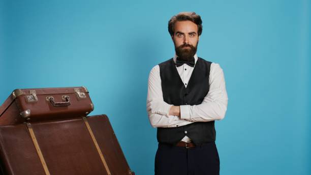 istock Hotel concierge poses with gloves 1607296504