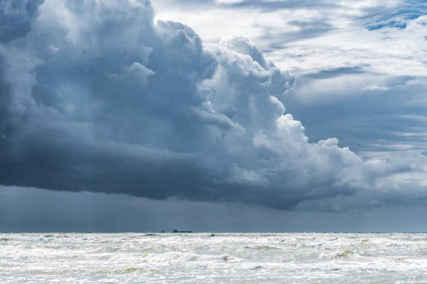istock Beautiful rough sea with big waves, and dramatic cloudy sky 1607297599