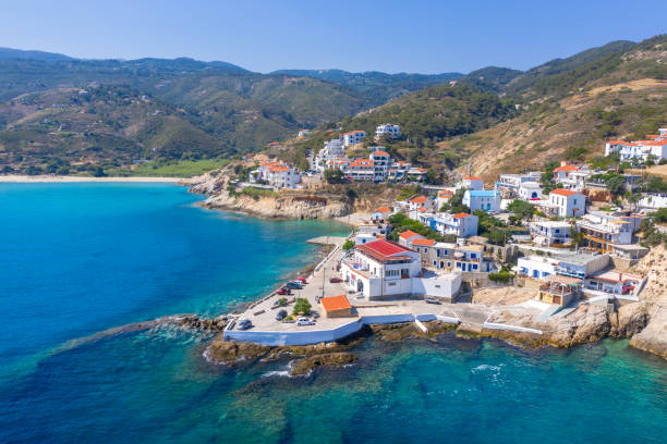 Picturesque small village of Armenistis with amazing sandy beach Mesakti in Ikaria island, Greece. Picturesque small village of Armenistis with amazing sandy beach Mesakti in Ikaria island, Greece. ikaria island stock pictures, royalty-free photos & images