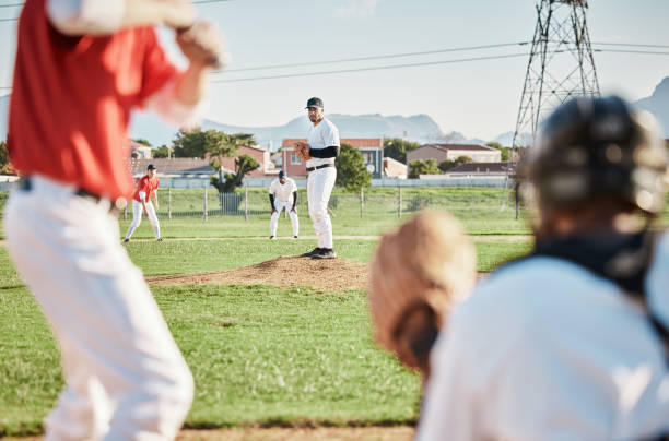 istock Men, pitcher or baseball player with glove in game, match or competition challenge on field, ground or stadium grass. Softball, athlete or sports people in pitching, teamwork collaboration or fitness 1607314677