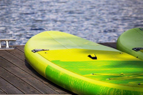 istock a yellow-colored kayak at the river's edge 1607315751