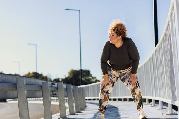 istock Young plus size women resting after running. 1607320516
