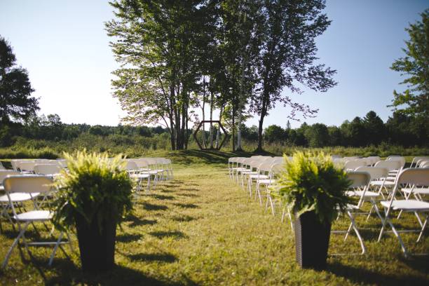 istock Joyous outdoor wedding ceremony site on a scenic waterfront location 1607349246