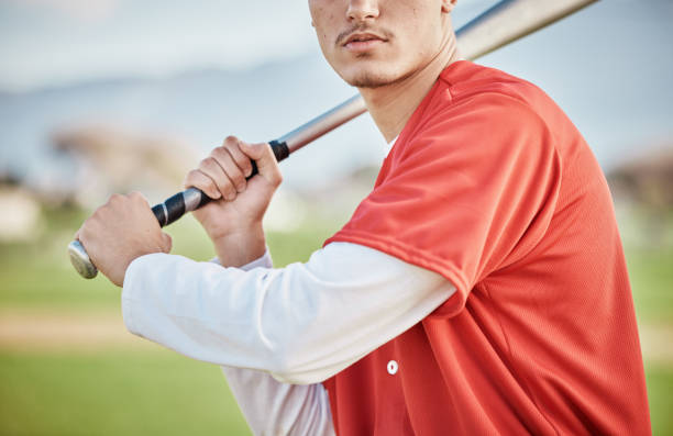 istock Baseball player, bat or man in a game competition, training match on stadium pitch closeup. Fun softball exercise, fitness workout or zoom of serious athlete playing sports with focused mindset 1607356975