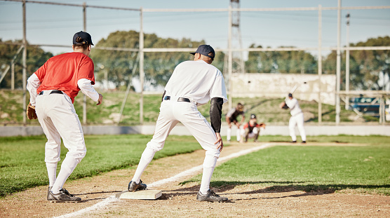 Sports, baseball and fitness with men on field for training, competition matcha and exercise. Home run, focus and teamwork with group of people playing in park stadium for pitcher, cardio and batter